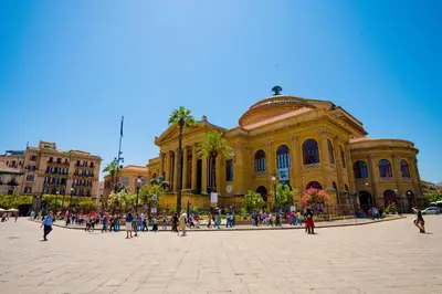 a group of people walking in front of a building at Le Stanze dei Tesori - Luxury Rooms in Palermo