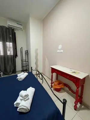 a hospital room with two beds and a table at Maya Palace Real Rooms Palermo centre close to Cathedral in Palermo