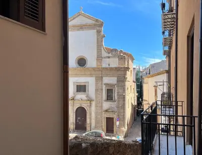 a view of a building from a window at Sant'Andrea - Luxury Rooms in Vucciria in Palermo