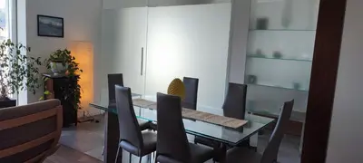 a dining room with a glass table and chairs at La terrazza sul Castello in Palermo