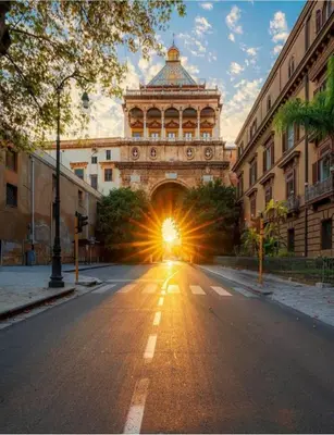 a building with a light at the end of a street at Hola House al Capo in Palermo