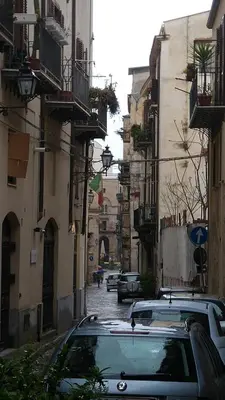 a car parked on a street with buildings at B&B Al Piazza Marina in Palermo