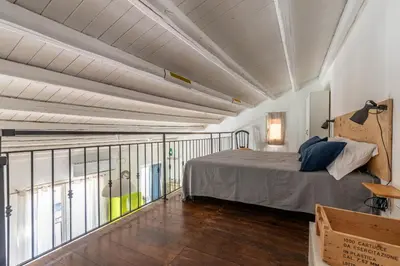 a bedroom with a bed and a balcony at Sant'Onofrio Apartments by Wonderful Italy in Palermo