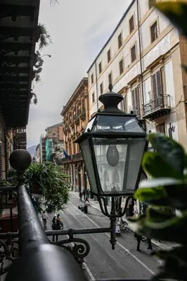 a street light on a city street with buildings at Quattrocantiapartments in Palermo