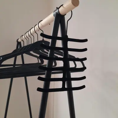 a bunch of hangers hanging on a wall at Quattrocantiapartments in Palermo