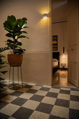 a potted plant sitting on a stand in a room at Nostrale bnb in Palermo