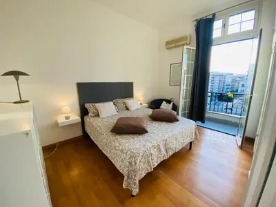 a bedroom with a bed with two pillows on it at POLITEAMA SUITE IN THE HEART OF THE CITY in Palermo