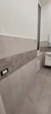 a bathroom with a shower and a toilet at HouseStation Suite in Palermo