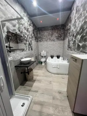 a bathroom with a tub and a toilet and a sink at La Casa di Bella in Palermo