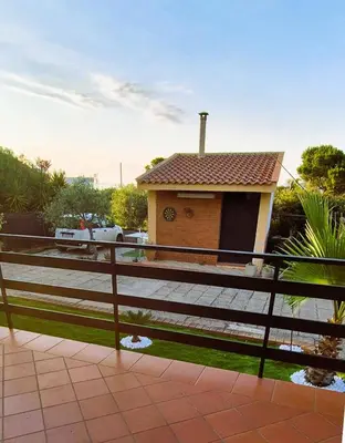 a house with a fence in front of it at Villa San Lorenzo Sicily in Altavilla Milicia