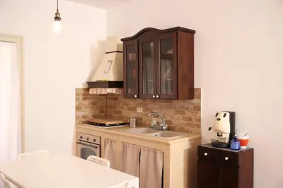 a kitchen with a sink and a counter top at Appartamento Rebecca in Palermo