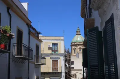 a statue of a man holding a shield at Briaria Apartment in Palermo