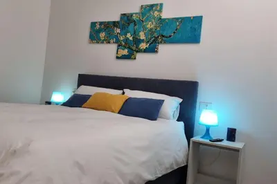 a bedroom with a bed with a cross on the wall at Simply the best - apartment and parking space by Balsamotto in Palermo