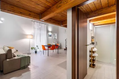 a living room with a couch and a table at Open Sicily Homes - Near the Central Train Station in Palermo
