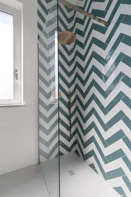 a shower with a blue and white patterned wall at Solemar Sicilia - Casa Margherita in Santa Flavia