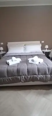 a large bed with two towels on top of it at SUITE PRINCIPE SCORDIA in Palermo