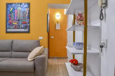 a living room with a couch and a table at Happie Casa La Cattedrale in Palermo