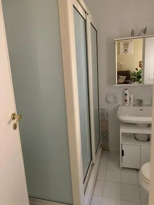a bathroom with a toilet and a sink at Casa Leila in Palermo