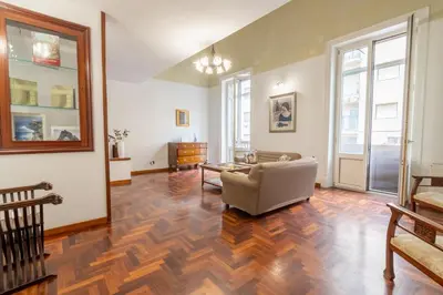 a living room with a couch and a table at MARIANO APARTMENT Palermo in Palermo