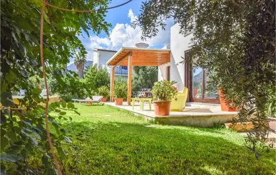 a garden with a gazebo in a yard at Gorgeous Home In Trabia With Wifi in Trabia