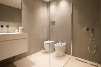a bathroom with a shower and a toilet and a sink at Luxury Libertà in Palermo