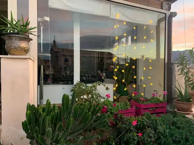 a store window with plants and lights in it at Stunning Kalsa in Palermo