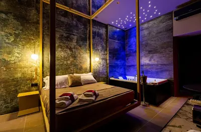 a bedroom with a bed in a room with lights at GOLD SUITE&SPA in Palermo