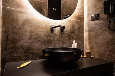 a bathroom with a bowl sink and a mirror at GOLD SUITE&SPA in Palermo