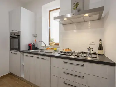 a kitchen with a sink and a stove top oven at Apartment Sole by Interhome in Balestrate