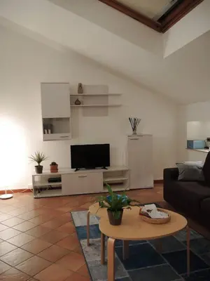 a living room with a couch and a table at Casa di Giulietta in Palermo