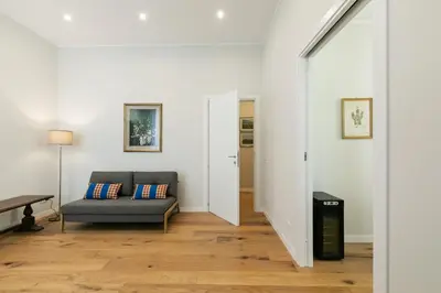 a living room with a couch and a table at GuestHost - NotHotel Palermo Central Bright Apartment in Palermo