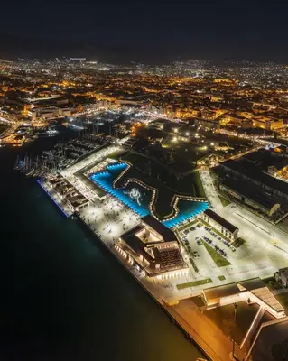 an aerial view of a harbor at night at Cala Apartment Centre in Palermo