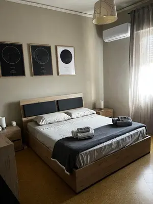 a bedroom with a large bed in a room at S&S in Palermo