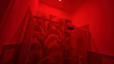 a red bathroom with a shower curtain in a room at Palermo Central in Palermo