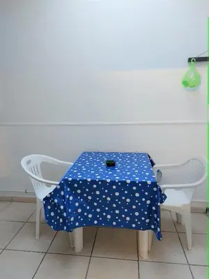 a table with a blue table cloth with white polka dots at CASA di ARTHUR in Palermo