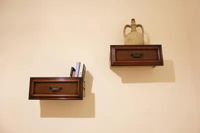 a wall with two wooden shelves and a vase on a wall at Sicilia Nica - appartamento privato a Cinisi (PA) in Cinisi