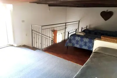 a bedroom with a bed and a staircase in a room at Residenza Lincoln in Palermo