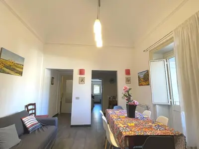 a living room with a table and a couch at Residenza Lincoln in Palermo