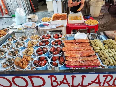 a food stand with different types of food on display at Montesanto House Palermo in Palermo