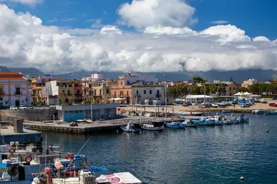 a group of boats docked in a harbor at Ciuri Ciuri in Isola delle Femmine
