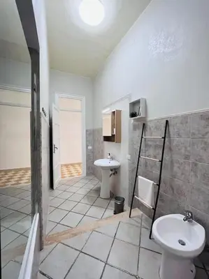 a bathroom with a toilet and a sink at Orethus Apartment - Exclusive Palermo Center in Palermo
