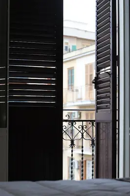 an open window with a view of a building at GREENHOME in Palermo