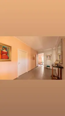 a living room with a staircase and a table at Dimora San Gregorio Luxury Rooms in Palermo