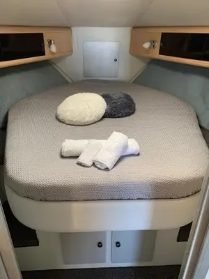a bed in a small room with two towels on it at Giorgia House Boat in Palermo