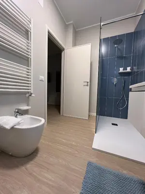 a bathroom with a tub and a sink and a shower at Turums B&B in Castellammare del Golfo