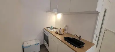 a small kitchen with a sink and a stove at Casa Vacanze L'Ortensia in Bagheria