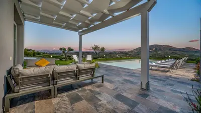 a patio with a bench and a swimming pool at DAMA DEI VENTI 6&2, Emma Villas in Castellammare del Golfo