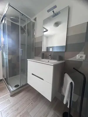 a bathroom with a sink and a shower at villa Macari in San Vito lo Capo