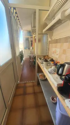 a kitchen with a counter and a counter top at Rosa Apartament in Palermo