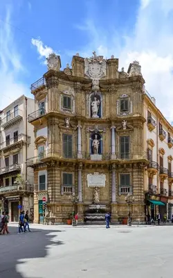 a large building with a clock on the front of it at Hostel Centro Città Basement in Palermo